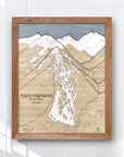 Framed map of Aspen Highlands on a white wall. Wooden ski resort map, laser engraved.