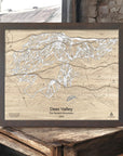 Wooden map of Deer Valley Ski Resort, Wasatch Mountains, Utah, framed on a rustic wooden frame in a ski cabin.