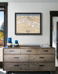 framed artwork of Discovery Ski Area above a dresser inside a modern ski cabin.