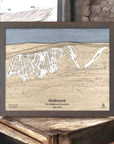 Wooden map of Holimont Ski Resort in The Allegheny Mountains, New York, framed on a rustic wooden surface inside a rustic ski cabin.