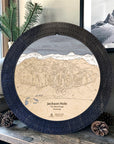 Matte Onyx Jackson Hole wooden cribbage board displayed with pinecones as modern ski cabin décor.
