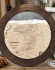 Rustic Mocha Revelstoke ski map cribbage board displayed with playing cards on a table in a cozy mountain lodge.