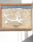Wooden 3D wood map of Ski Butternut Ski Trails on a white wall in a bright and modern ski chalet.