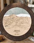 Sugar Bowl ski trail map cribbage board in Rustic Mocha styled on a cabin table.