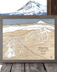 Wooden layered map of White Pass Ski Area with a mountainous landscape in the background