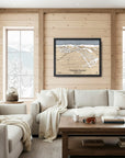 Cozy ski house living room with wooden walls, a sofa, and a large format framed map of Whitewater Ski Resort on the wall.