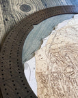Close-up of the engraved ski trails and mountain terrain featured on the Heavenly Ski Map Cribbage Board.