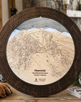 Espresso stained Heavenly Mountain cribbage board displayed as rustic ski house décor with cards and cribbage pegs.