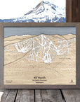 Wooden map of 49 Degrees North Ski Resort with a scenic background