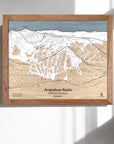 Wooden framed map of Arapahoe Basin Ski Resort in The Rocky Mountains, Colorado on a white wall.