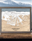 Wooden map of Arapahoe Basin Ski Resort with a mountainous background
