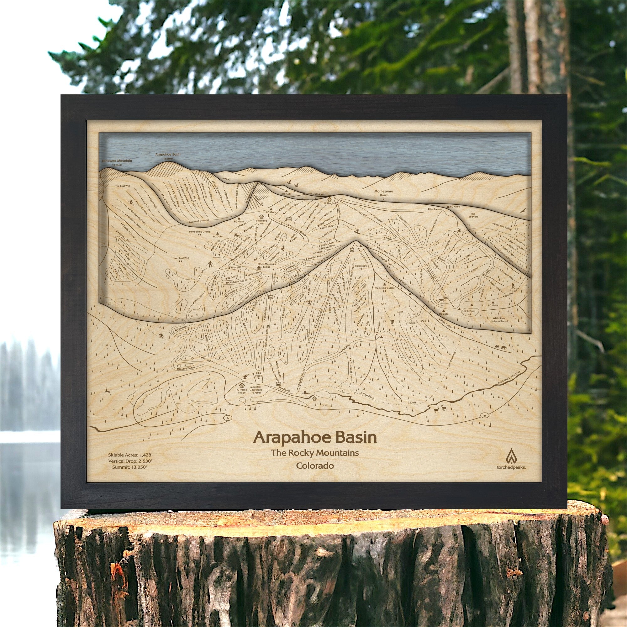 Matte Onyx Arapahoe Basin 3D wood ski map displayed beside a lake, framed in black with layered terrain and engraved ski trails.