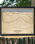 Matte Onyx Arapahoe Basin 3D wood ski map displayed beside a lake, framed in black with layered terrain and engraved ski trails.