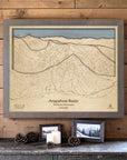 Storm Grey Arapahoe Basin ski map wall art mounted on a wood-paneled wall in a cozy ski cabin.