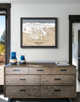 Arapahoe Basin Ski Resort map hanging on a wall above a dresser. 