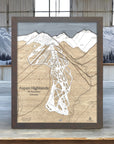 Framed map of Aspen Highlands ski resort with mountain and forest background