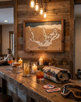 Handcrafted Bear Mountain California wood ski map displayed above a rustic après ski home bar in a luxury mountain cabin.
