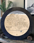 Matte Onyx Beaver Creek ski map cribbage board displayed with pinecones as modern ski cabin décor.