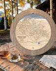 Weathered Timber Beaver Creek ski map cribbage board displayed outdoors with whiskey glasses and playing cards.