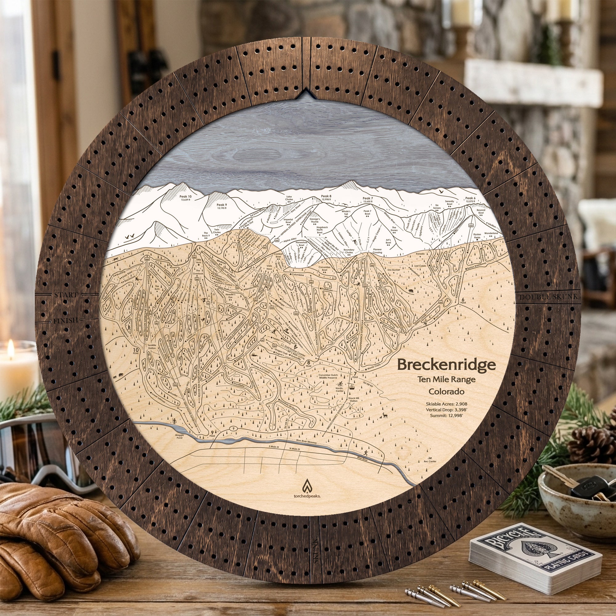 Rustic Mocha Breckenridge wooden cribbage board with playing cards and snacks, a unique gift for skiers.