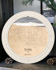Arctic White Brundage Mountain ski map cribbage board displayed with pinecones and greenery as ski cabin décor.