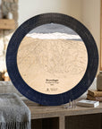 Matte Onyx Brundage Mountain ski map cribbage board displayed beside books and a gray blanket in a bright cabin interior.