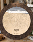 Rustic Mocha Brundage Mountain ski map cribbage board staged with cards and snacks, a unique gift for skiers.