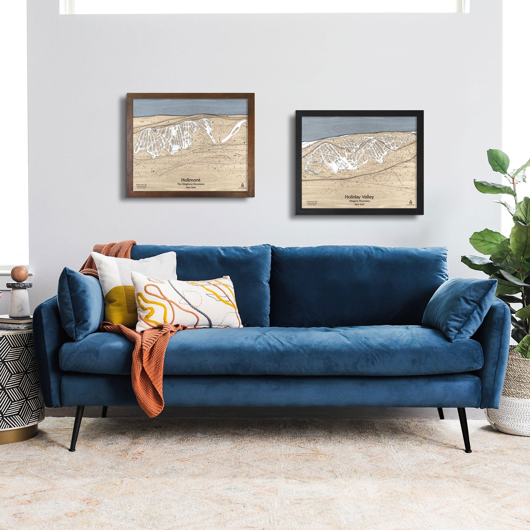 Framed artwork of Holimont Ski Resort in New York on a white wall in a modern ski chalet. 