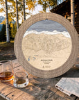 Weathered Timber Jackson Hole ski map cribbage board outdoors with whiskey glasses and cards for après-ski game night.