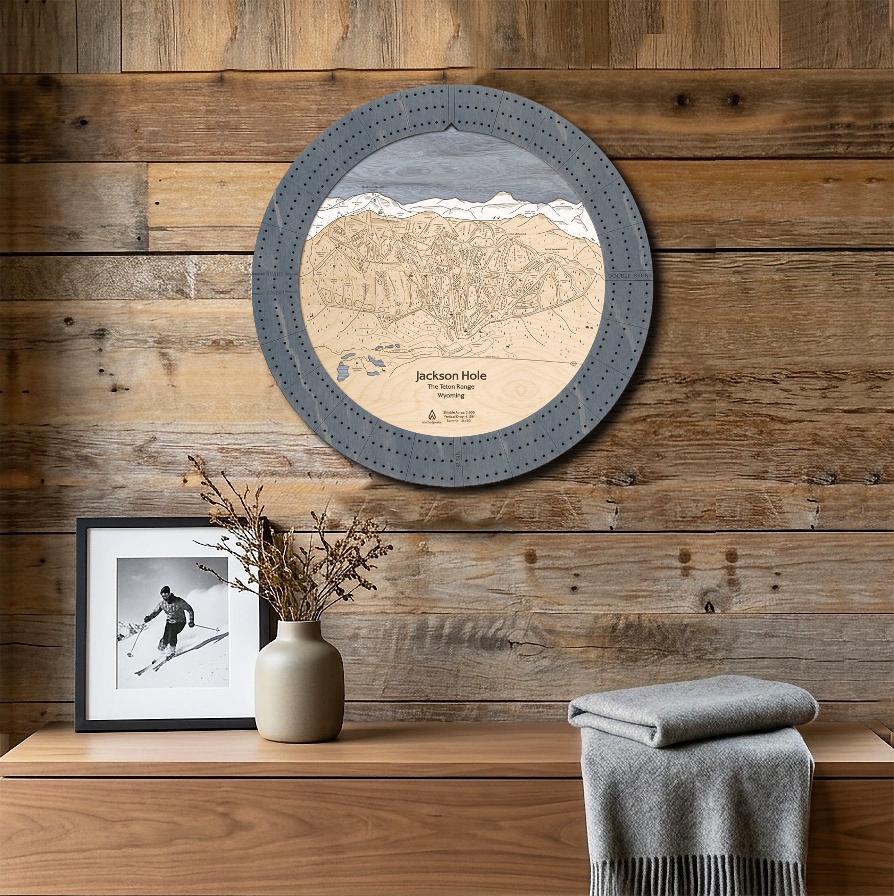 Jackson Hole ski map cribbage board mounted on a reclaimed-wood wall as handcrafted ski cabin wall art.