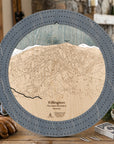 Killington ski trail map cribbage board in Graphite Grey styled on a rustic cabin table.