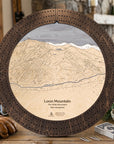 Rustic Mocha Loon Mountain wooden ski map cribbage board staged with playing cards and snacks for apres ski game night.