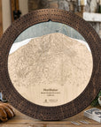 Northstar wooden ski trail map cribbage board in Rustic Mocha styled on a cabin table.