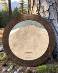 Northstar ski map cribbage board in Rustic Mocha displayed outdoors against a pine tree.