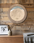 Northstar ski map cribbage board displayed as round wall art above a rustic wood console.