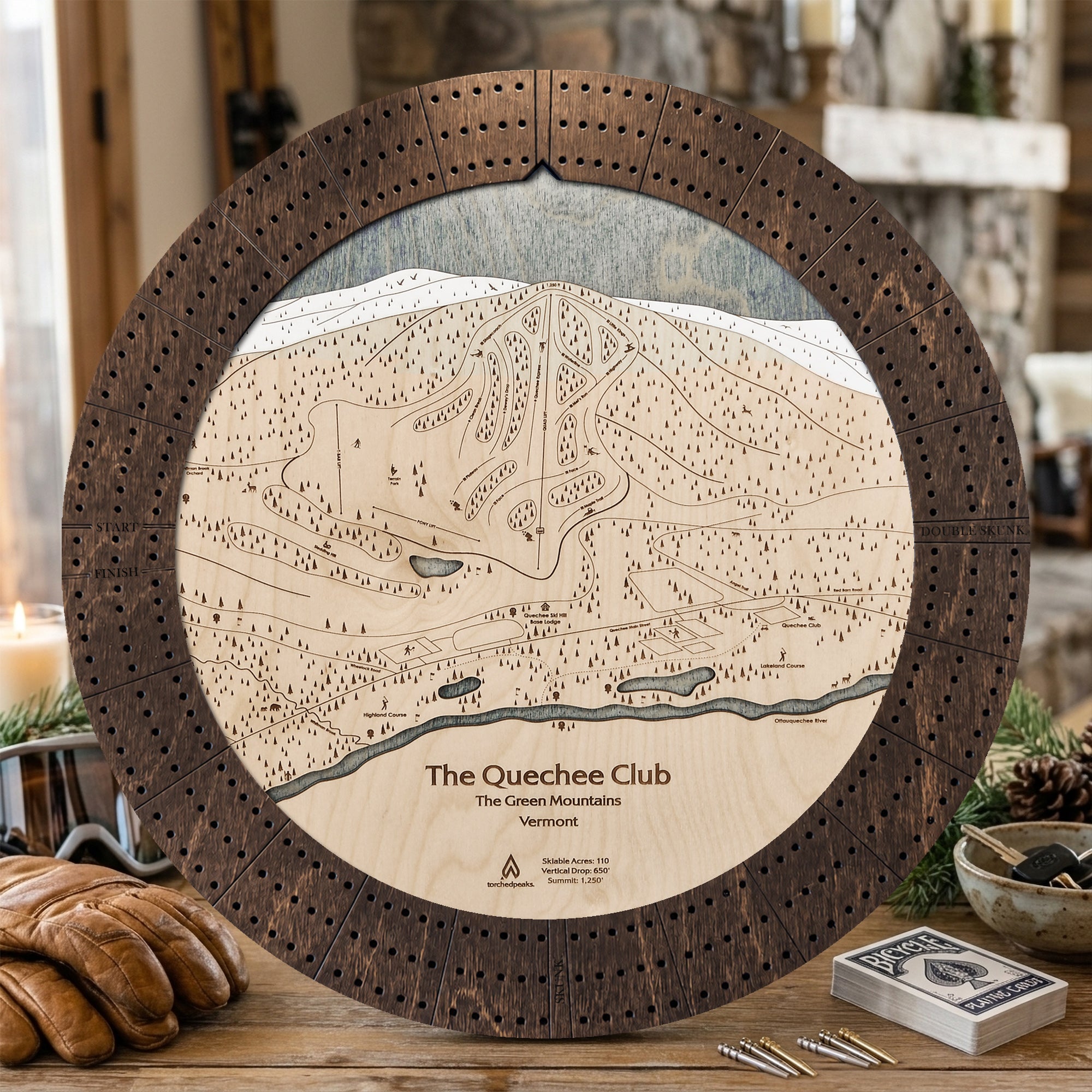 Rustic Mocha Quechee Club wooden cribbage board featuring engraved Vermont ski trails, displayed with playing cards.