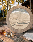 Weathered Timber Quechee Club ski map cribbage board outdoors with whiskey glasses and cards for après-ski game night.