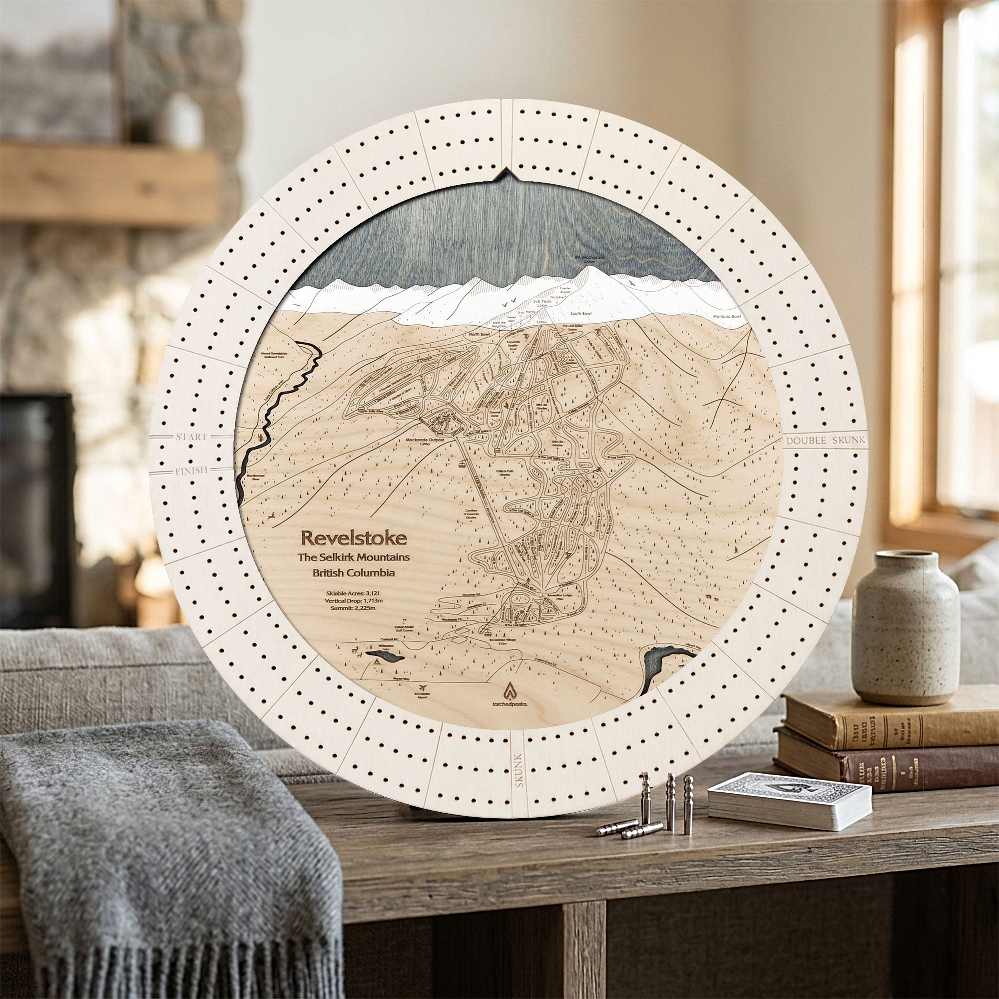Revelstoke ski map cribbage board in Arctic White displayed in a bright mountain home, a handcrafted gift for skiers