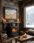 Handcrafted Sugar Bowl California wood ski map displayed above a fireplace in a cozy mountain cabin with snowy winter views