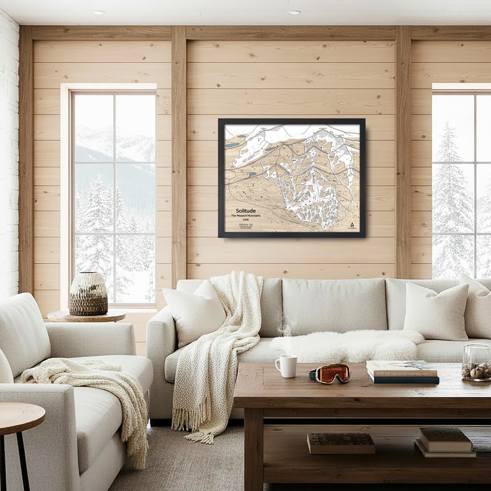 Cozy living room with wooden walls, a sofa, and large format artwork of Solitude Mountain Ski Resort. 
