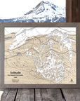 Framed ski resort map of Solitude, Utah with a mountainous landscape in the background.
