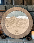 Sugar Bowl cribbage board in Weathered Timber beside a stone fireplace with candles and pinecones.