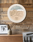 Sugar Bowl ski map cribbage board displayed as round wall art above a rustic wood console