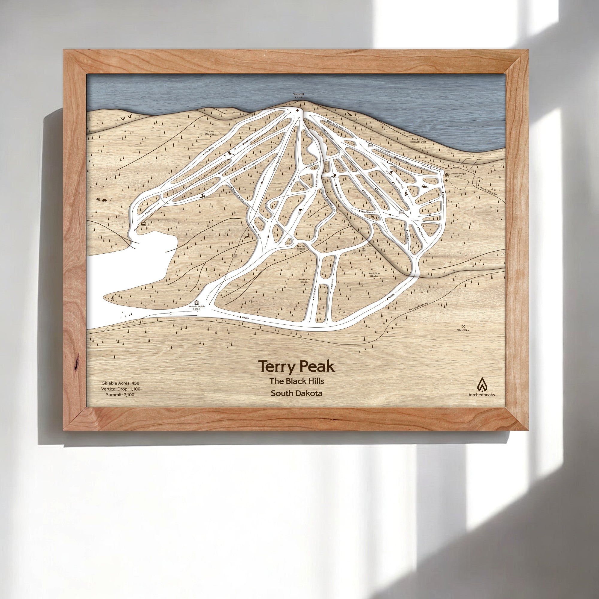 Wooden framed ski map of Terry Peak Ski Resort in the Black Hills, South Dakota.