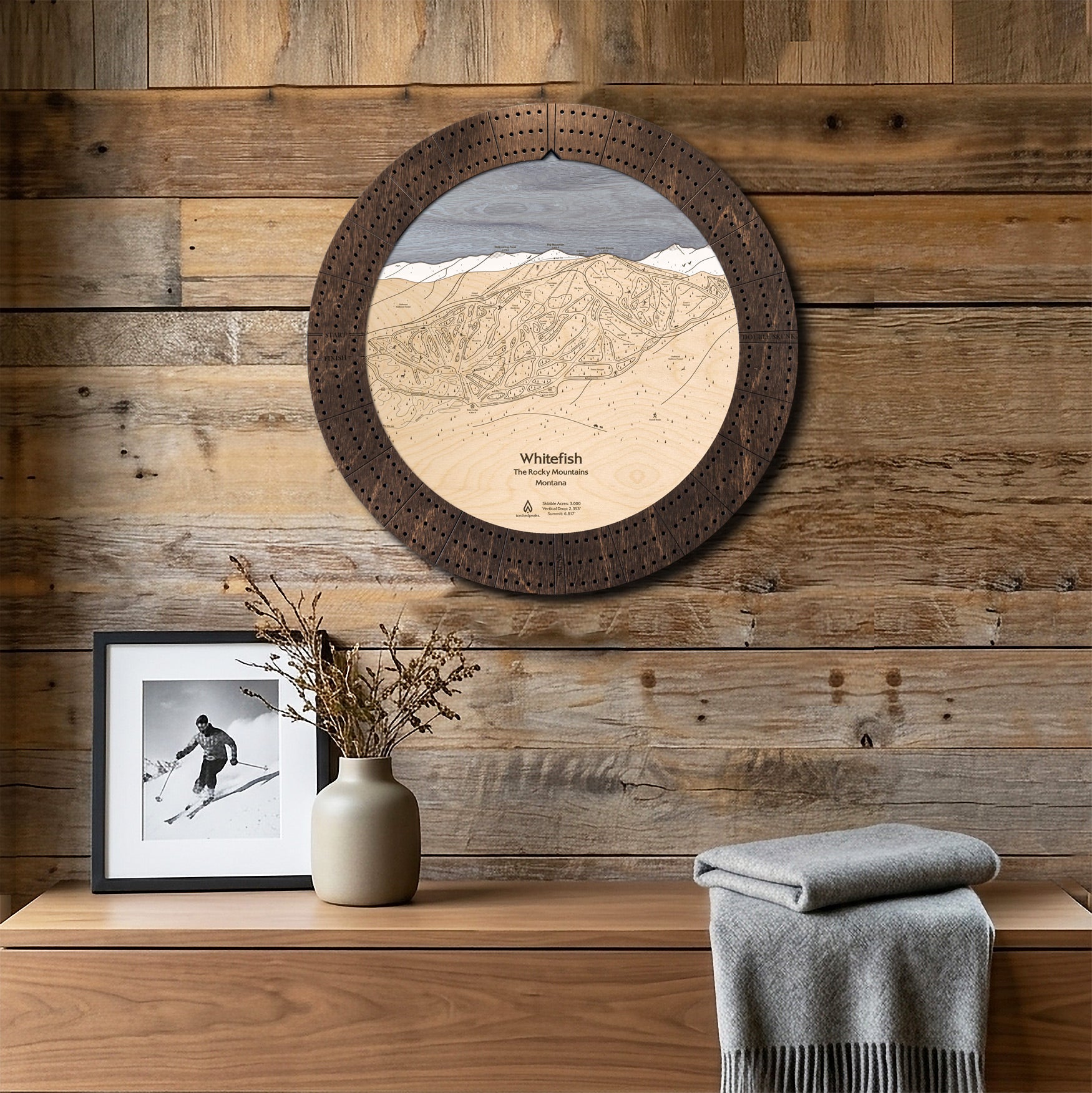 Whitefish Mountain ski map cribbage board displayed on a reclaimed-wood wall as functional ski cabin wall art.