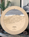 Birch Whitefish Mountain wooden cribbage board displayed with pinecones as rustic ski cabin décor.