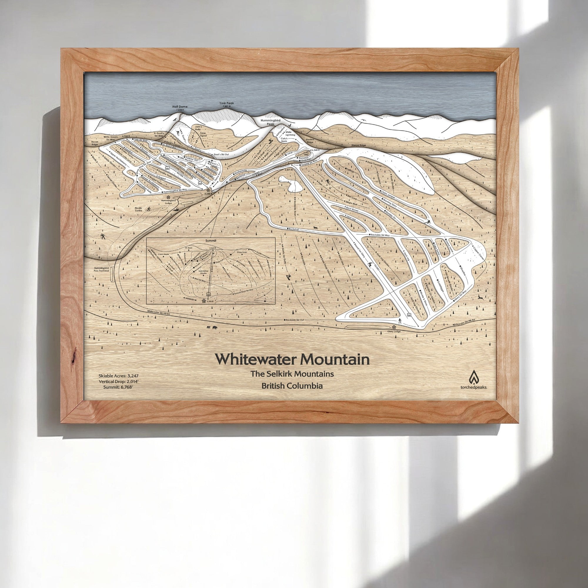 Wooden framed map of Whitewater Mountain Ski Resort in a bright ski chalet