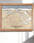 Wooden framed map of Whitewater Mountain Ski Resort in a bright ski chalet