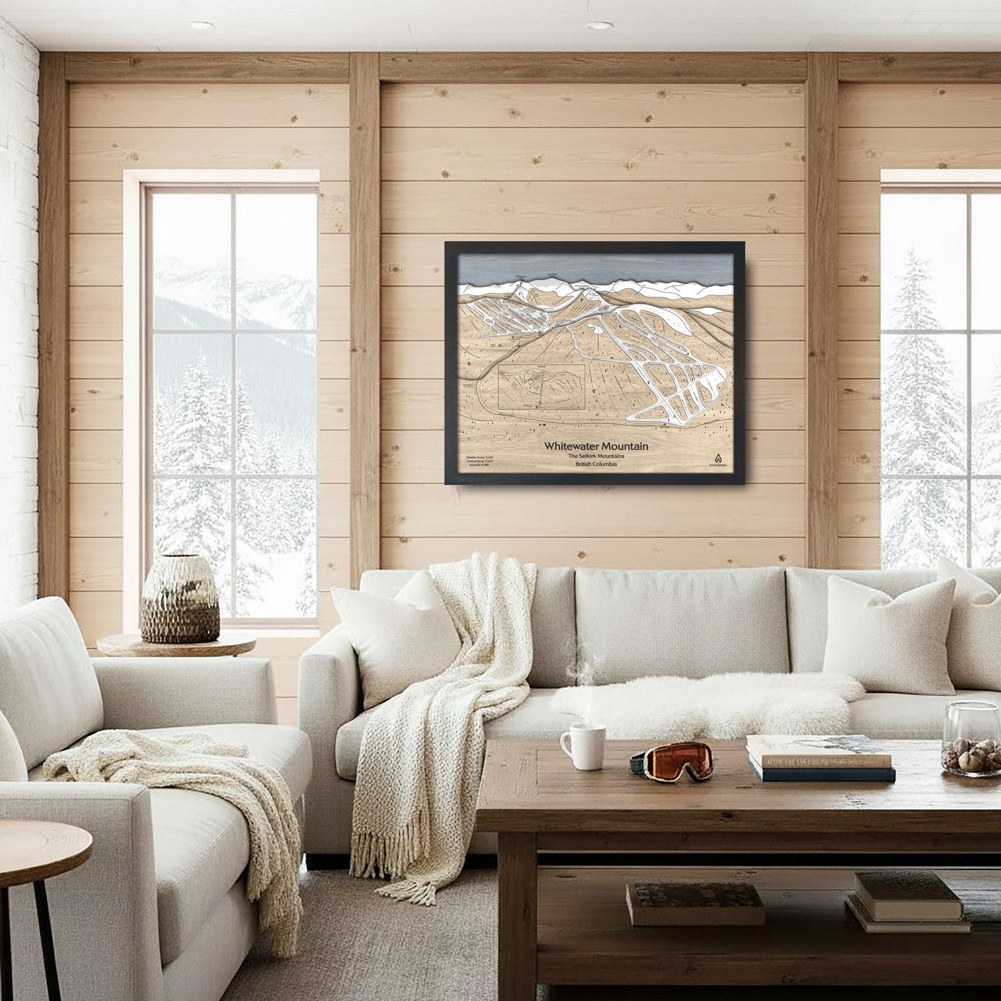 Cozy ski house living room with wooden walls, a sofa, and a large format framed map of Whitewater Ski Resort on the wall.