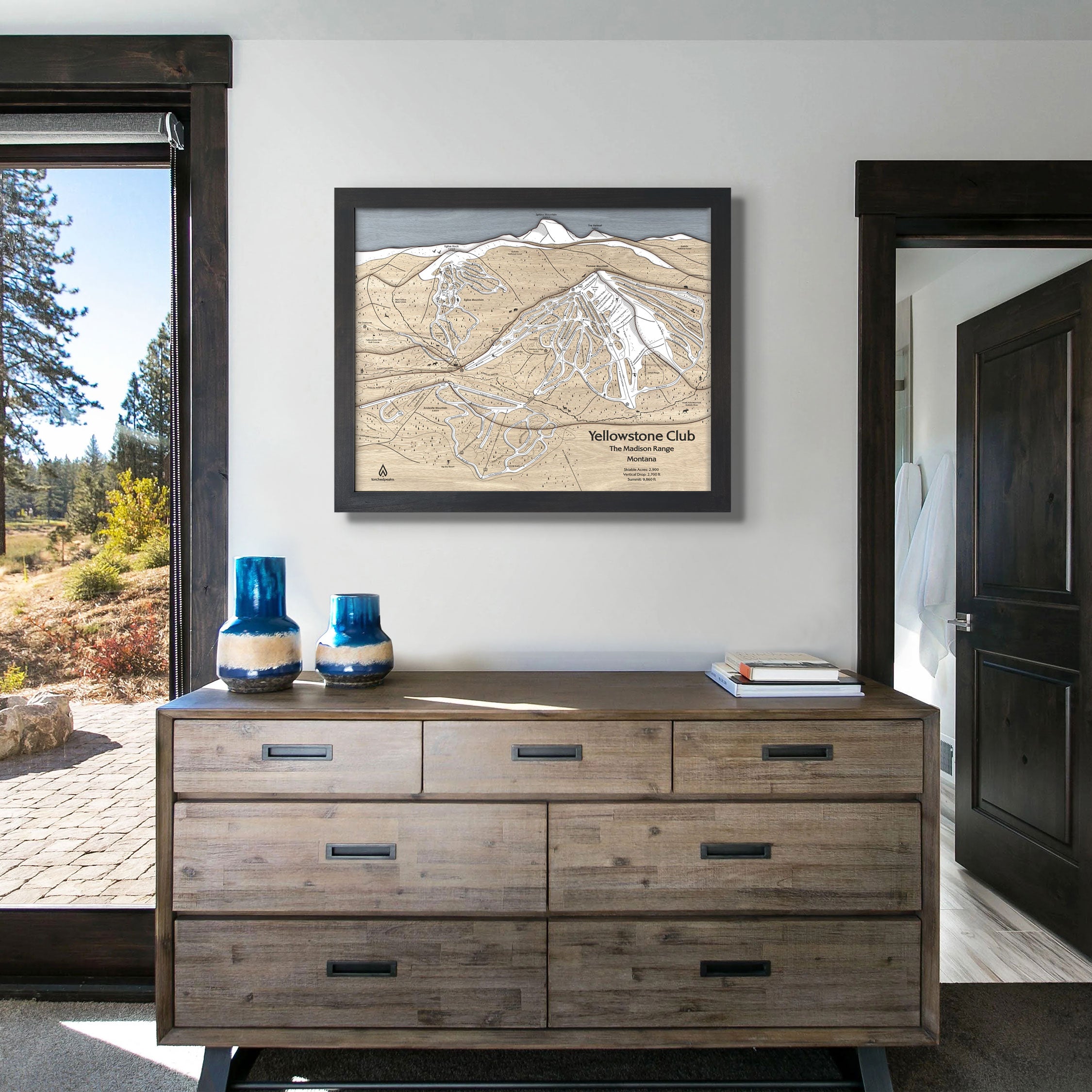 Framed large format artwork of Yellowstone Club Ski Resort on a wall in a modern ski house. 